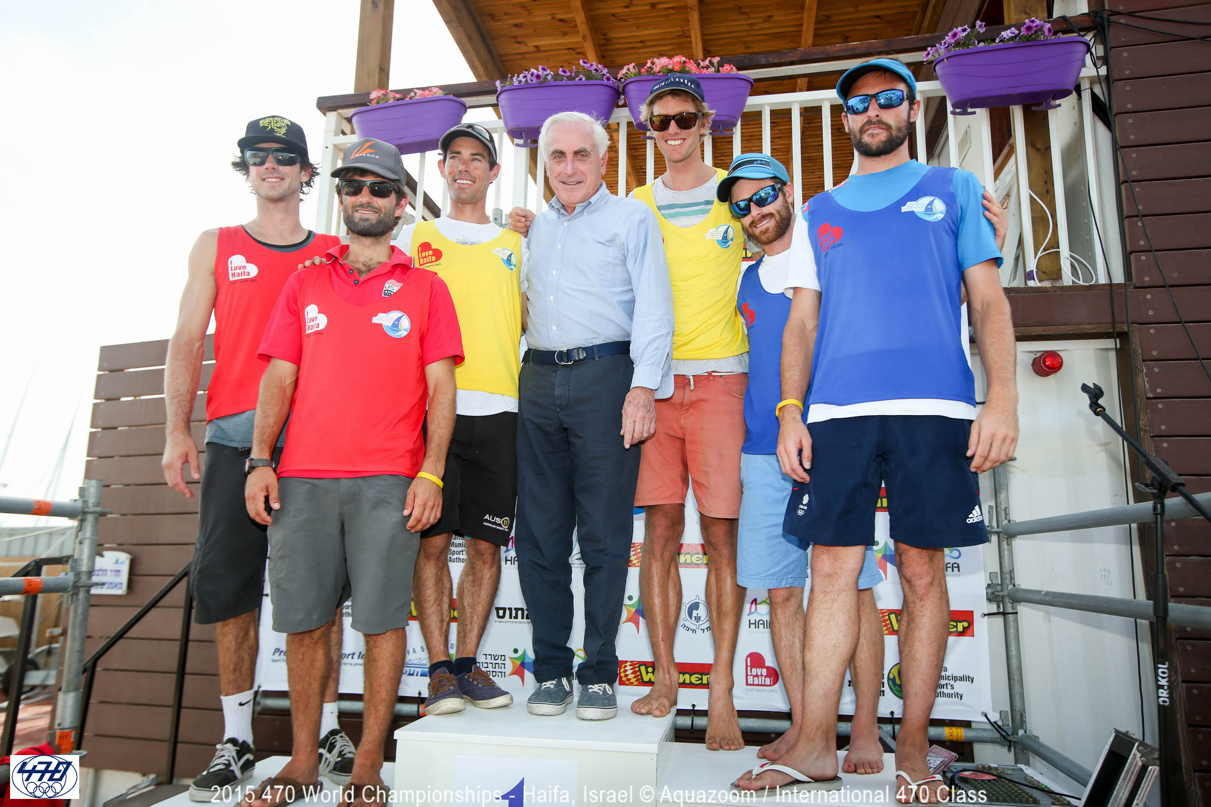 ISAF President Carlo Croce presents leader bibs to the 470 Men